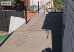 монтаж веранды вокруг дома с использованием террасной доски из ДПК Good Cover линейки Стандарт, цвет коричневый