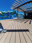 Укладка террасной доски из ДПК в парк-отеле Новый Век, в аквакомплексе NOVA PARADISE. Энгельс.